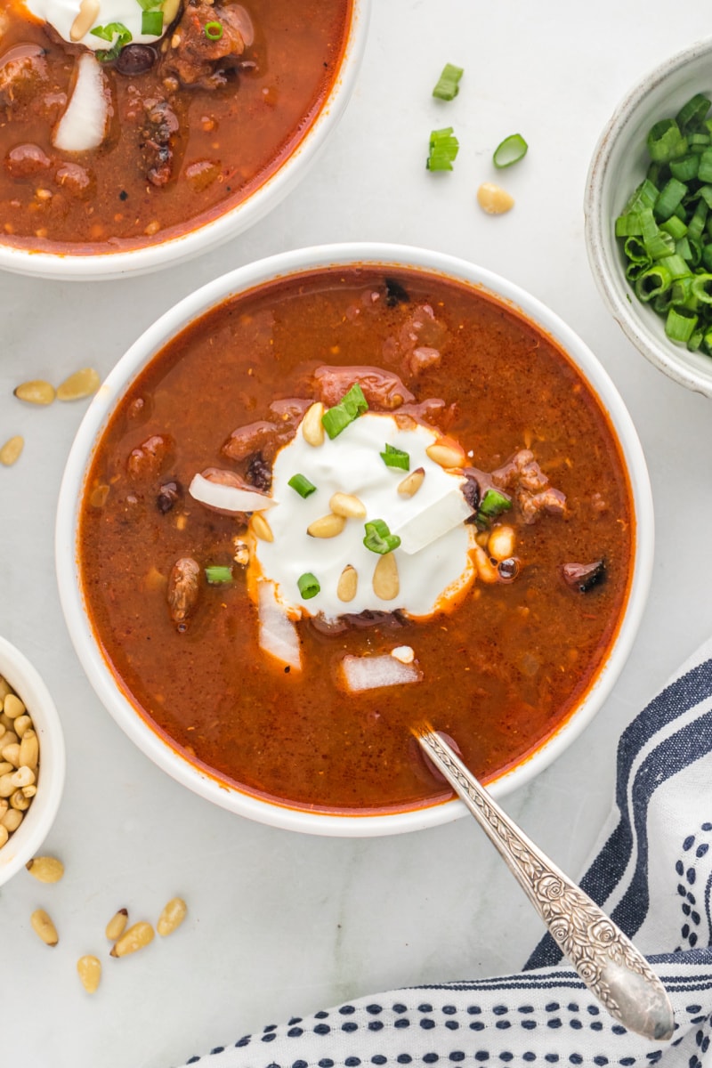 bowl of chili topped with sour cream