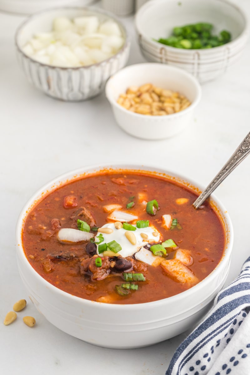 lamb and black bean chili in a white bowl