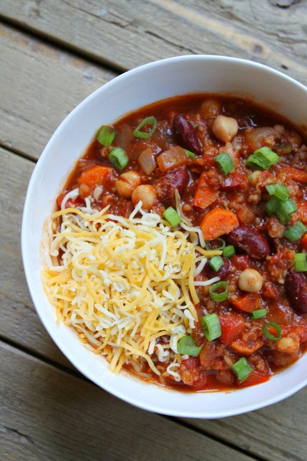 Spicy Vegetarian Chili recipe from RecipeGirl.com #spicy #vegetarian #chili #recipe #RecipeGirl Bowl of Spicy Vegetarian Chili with cheese