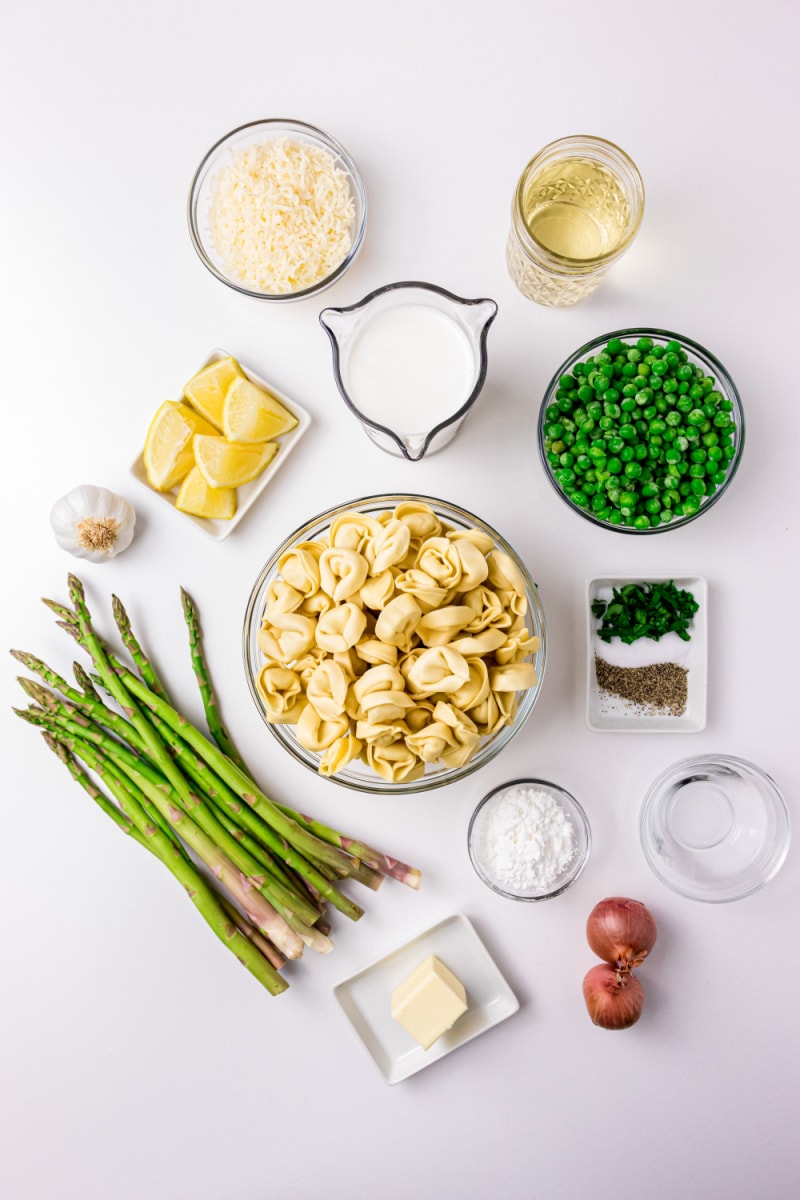 ingredients displayed for making Tortellini, Peas and Asparagus with Creamy Tarragon Sauce