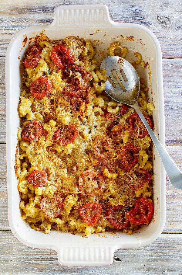 Mac and Cheese with Roasted Tomatoes in a white casserole dish