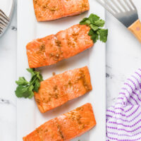 asian salmon filets on a white platter