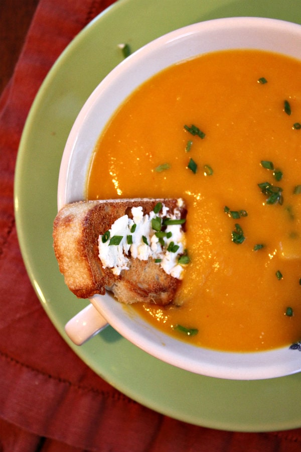 Autumn Vegetable Soup from RecipeGirl.com #soup #comfortfood #vegetablesoup #vegetables #recipegirl Autumn Vegetable Soup with a piece of toast in a white bowl