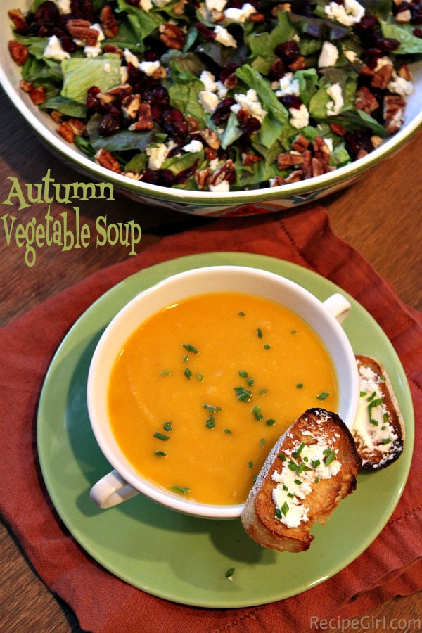 Autumn Vegetable Soup from RecipeGirl.com #soup #comfortfood #vegetablesoup #vegetables #recipegirl Autumn Vegetable Soup in a white bowl with salad and toasted bread