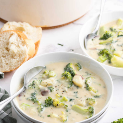 spoon in a bowl of broccoli potato soup