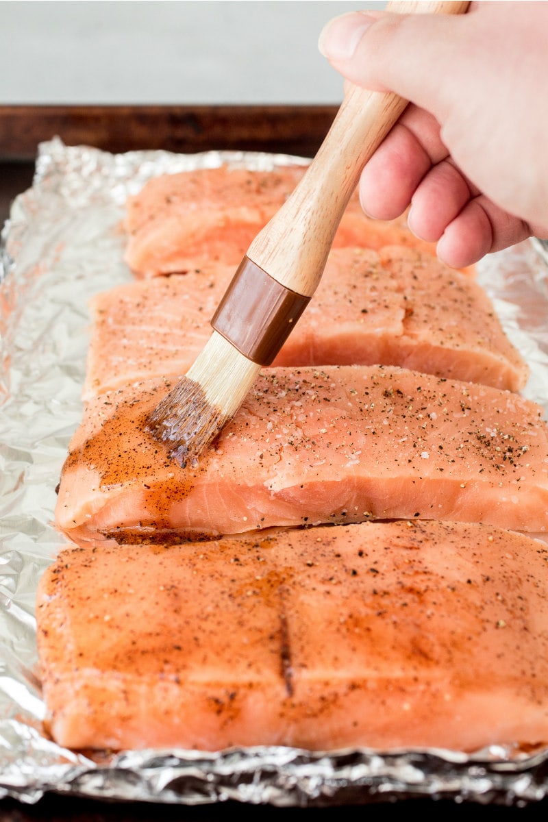 prepping salmon to bake