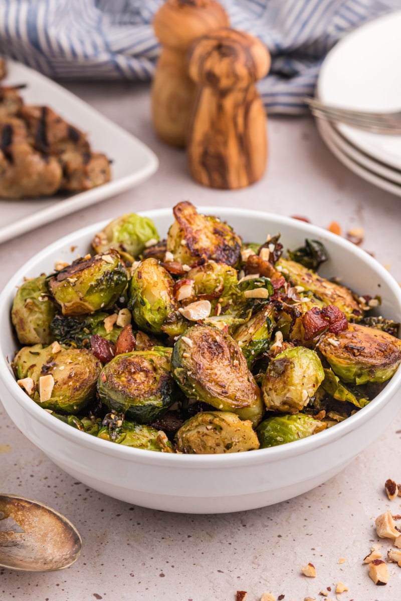 bowl of brussels sprouts with bacon and hazelnuts