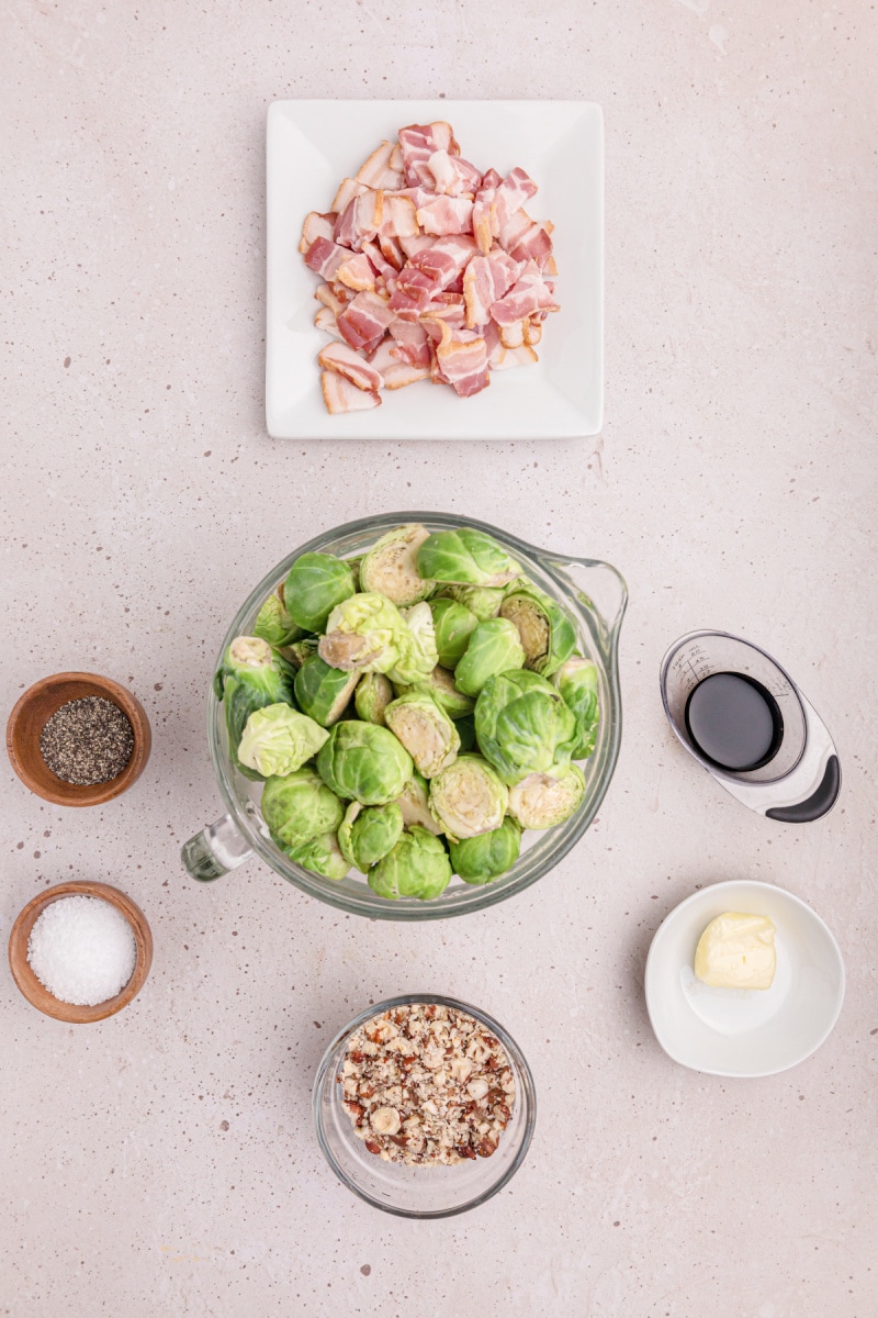ingredients displayed for making brussels sprouts with bacon and hazelnuts