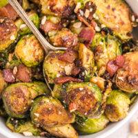 pan of brussels sprouts with bacon and hazelnuts