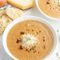 caramelized onion soup in a white bowl