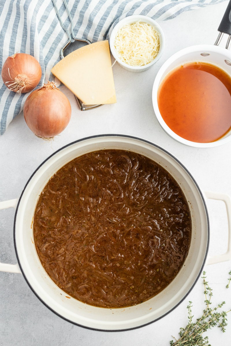 showing process of making caramelized onion soup in soup pot