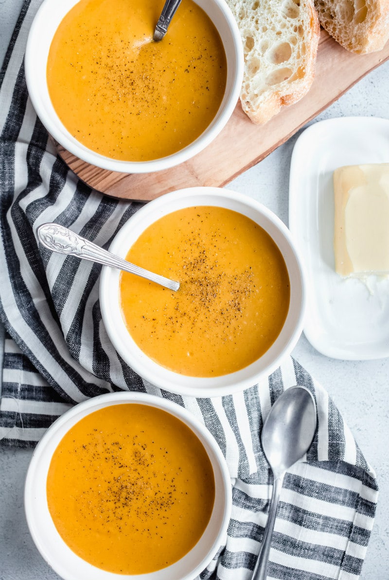 Carrot and Butternut Squash Soup recipe from RecipeGirl.com #carrot #butternut #squash #butternutsquash #soup #recipe #RecipeGirl bowls of carrot and butternut squash soup
