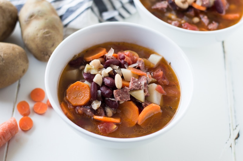 white bowl of bean and chorizo soup