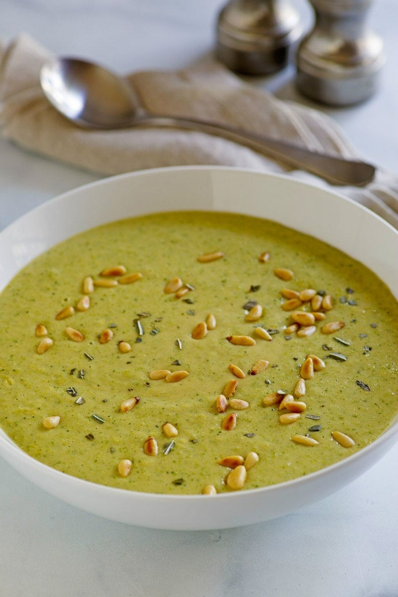 Creamy Broccoli Soup recipe from RecipeGirl.com #creamy #creamofbroccoli #broccoli #soup #recipe #weightwatchers #smartpoints #RecipeGirl Bowl of Creamy Broccoli Soup garnished with toasted pine nuts