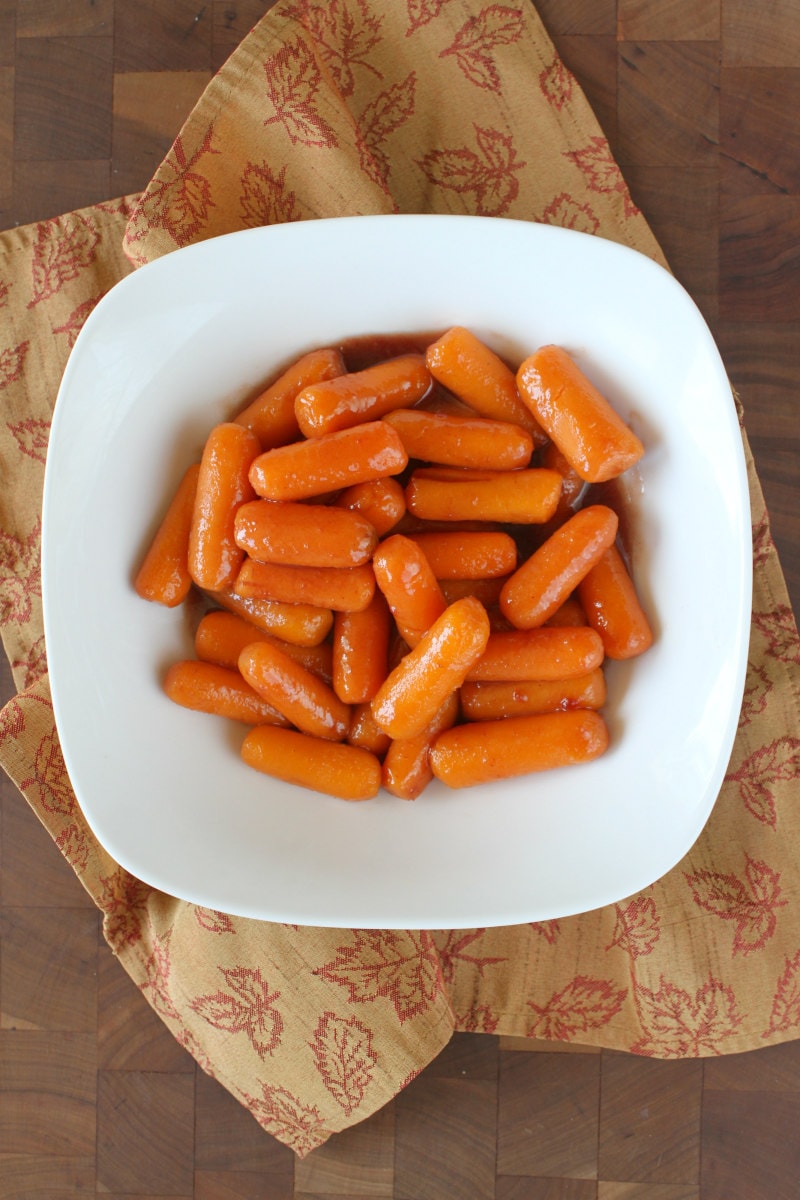Glazed Cranberry Carrots recipe from RecipeGirl.com #glazed #cranberry #carrots #recipe #RecipeGirl Bowl of Glazed Cranberry Carrots
