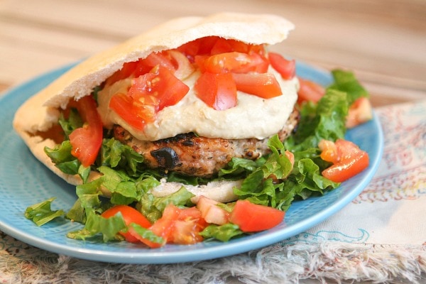Greek Turkey Burgers recipe from RecipeGirl.com Greek Turkey Burger on a blue plate