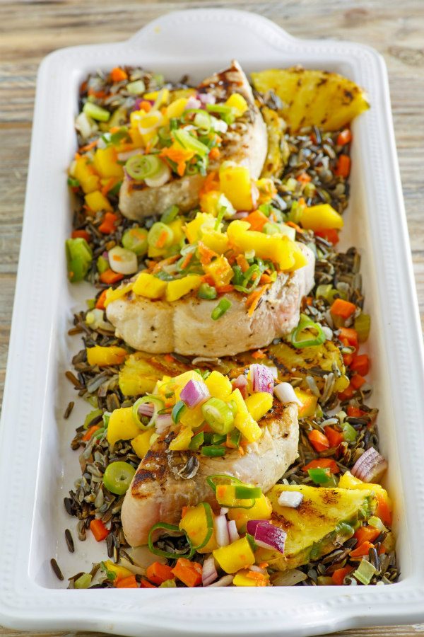 Grilled Swordfish with Mango Salsa laid out in a white casserole dish