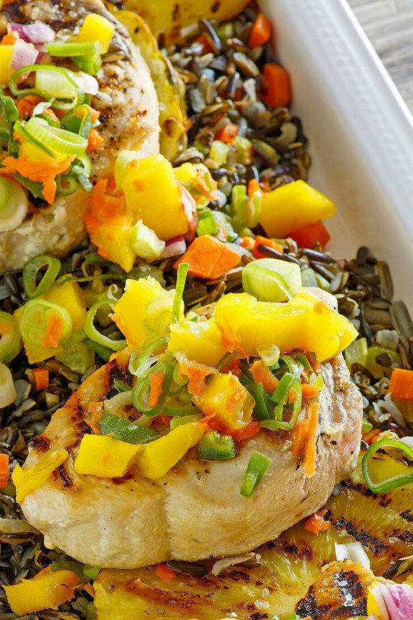 Grilled Swordfish topped with Mango Salsa in a white serving dish