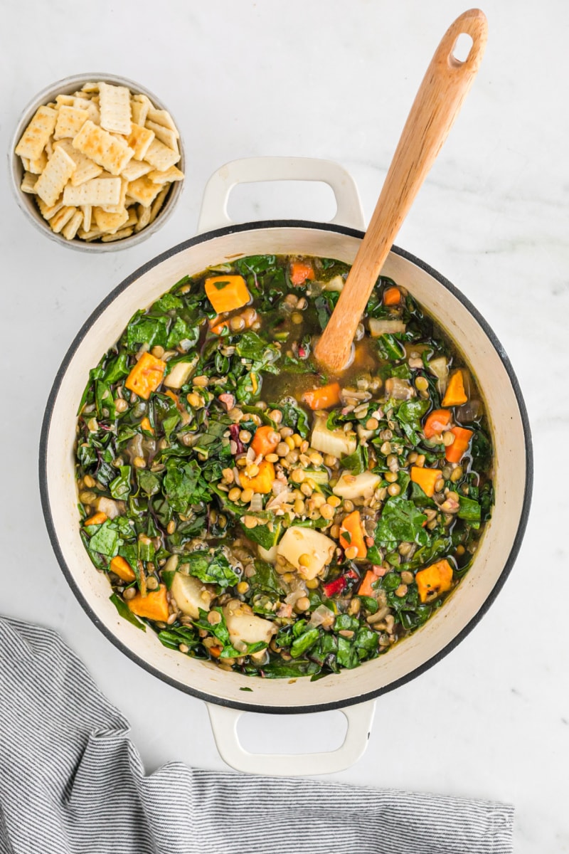 pot of lentil soup with balsamic roasted vegetables