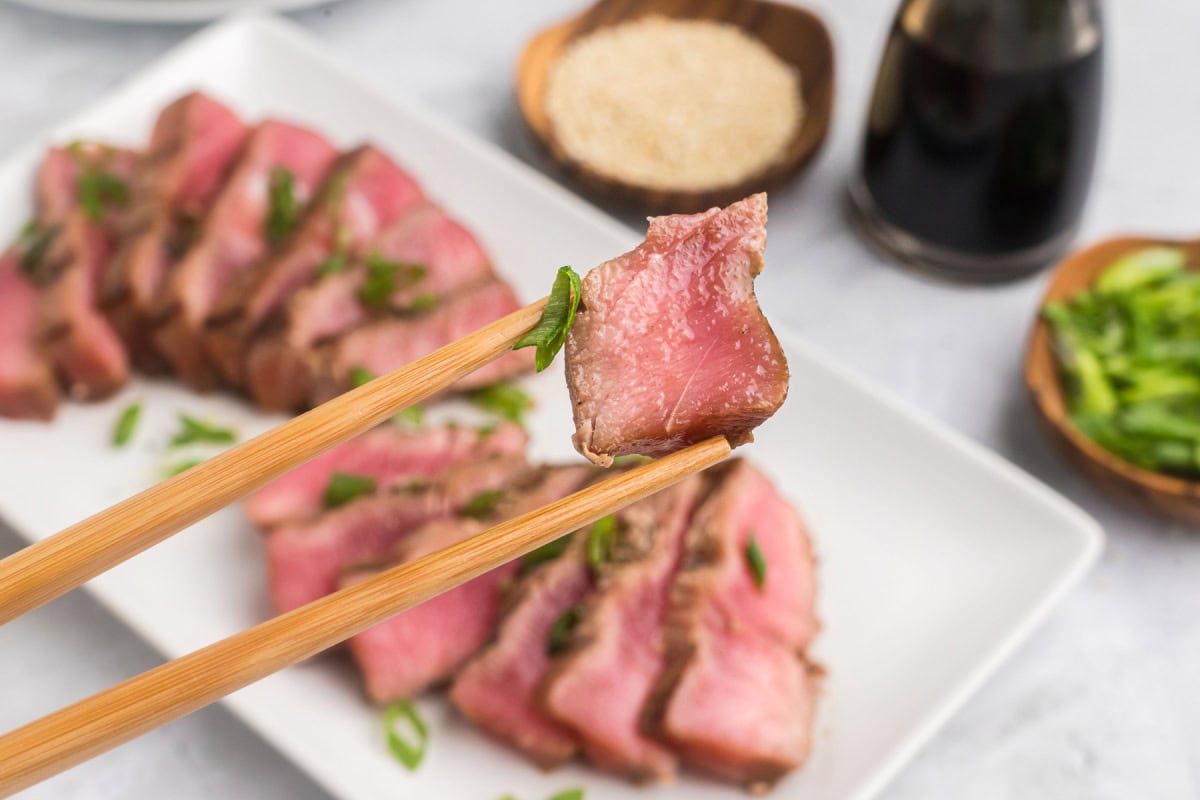 chopsticks holding maple soy grilled tuna