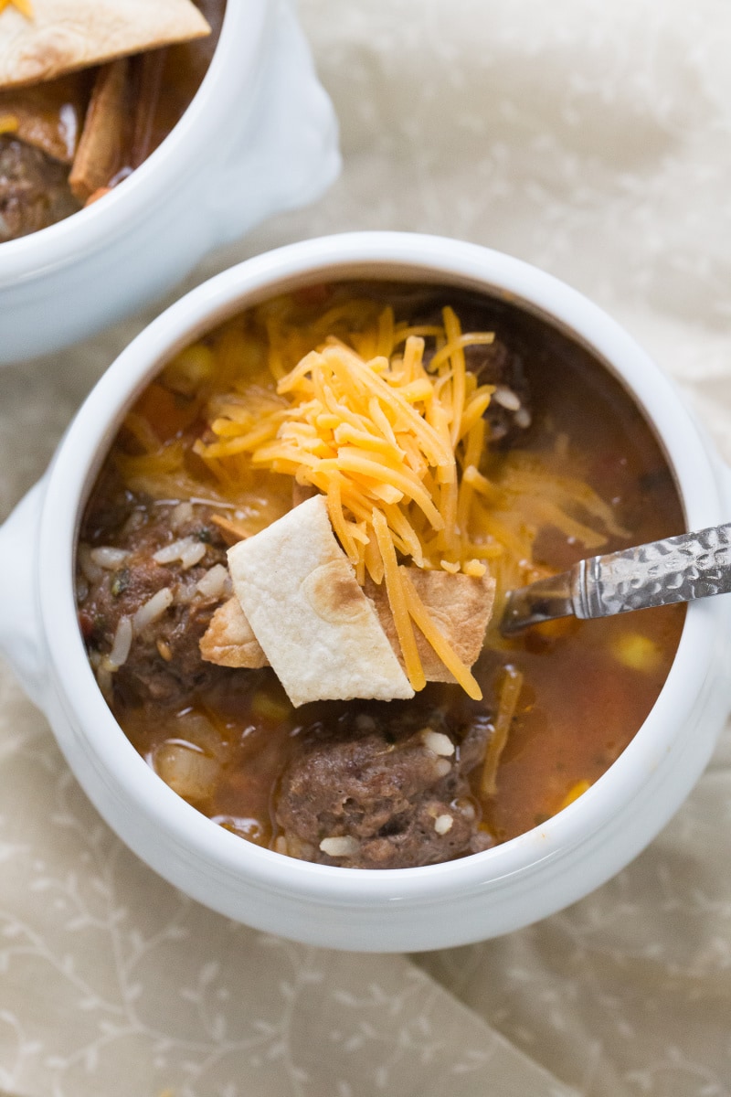 one white bowl of mexican meatball and sausage soup