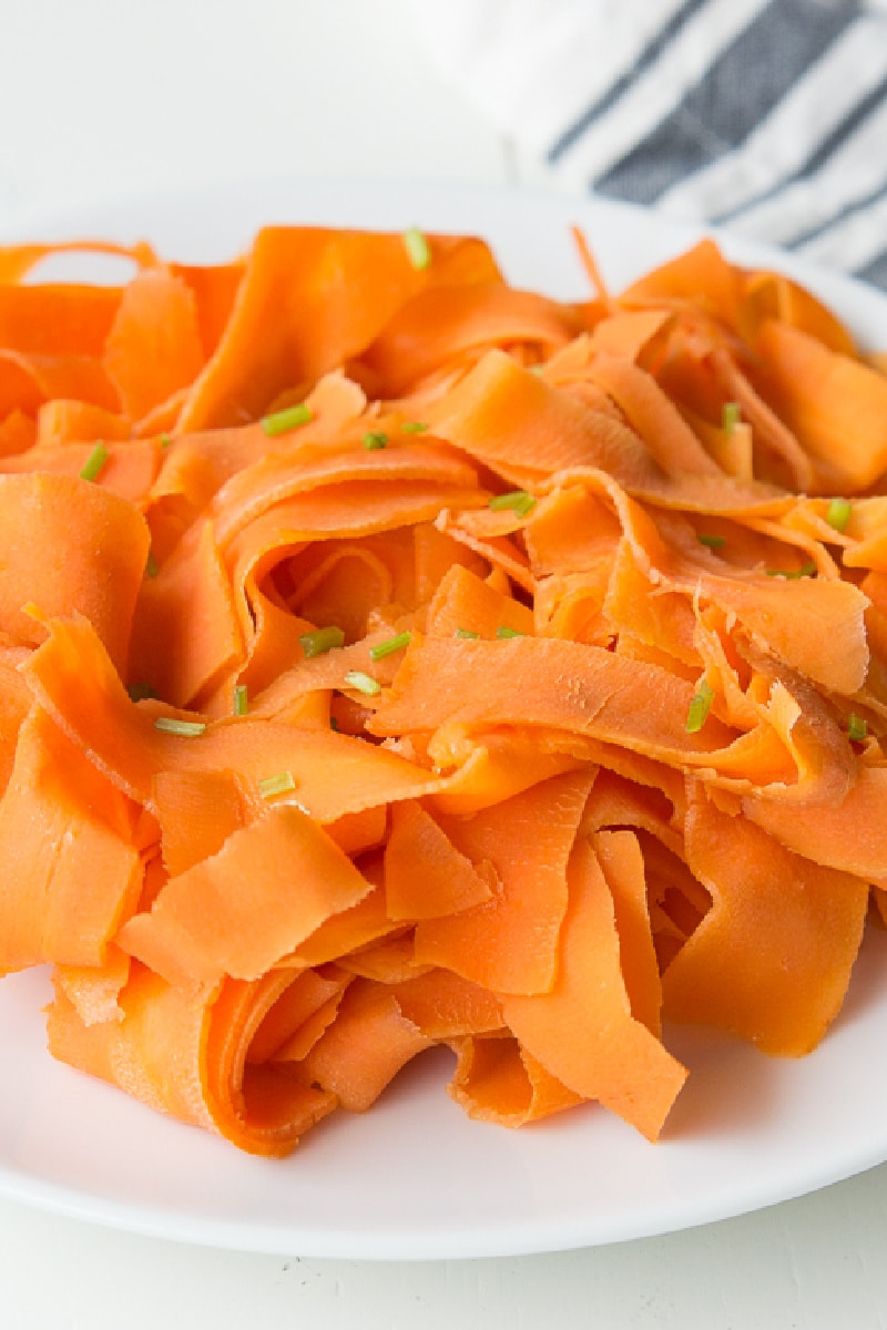 carrot ribbons on a white plate