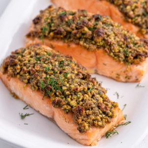 pistachio baked salmon filets on platter