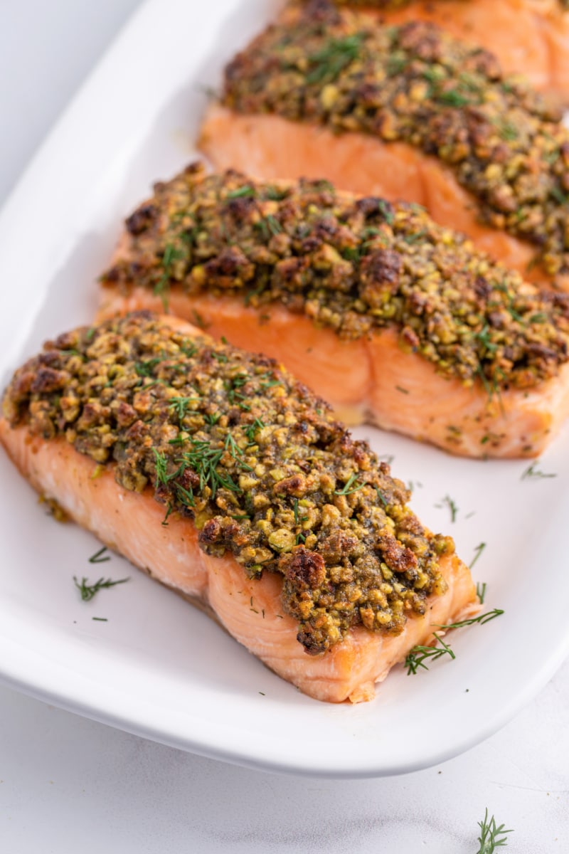 pistachio baked salmon filets on platter