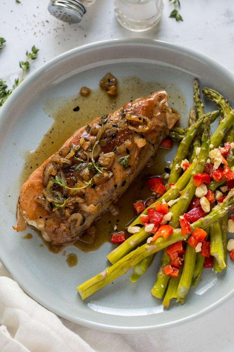 prosciutto roasted halibut on plate with asparagus