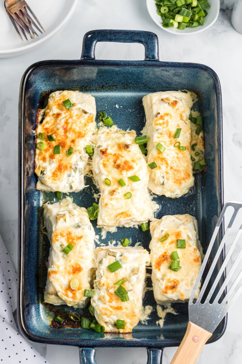 several piece of swiss parmesan halibut in baking dish