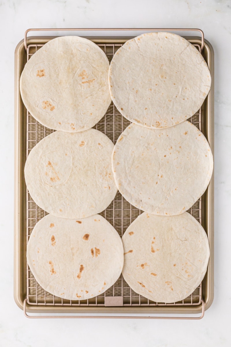 flour tortillas on a baking sheet