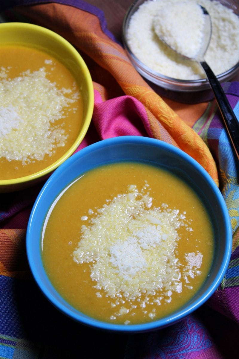 Tuscan Pumpkin White Bean Soup recipe from RecipeGirl.com #tuscan #pumpkin #bean #soup #fall #recipe #RecipeGirl Bowls of Tuscan Pumpkin White Bean Soup served with grated Parmesan cheese