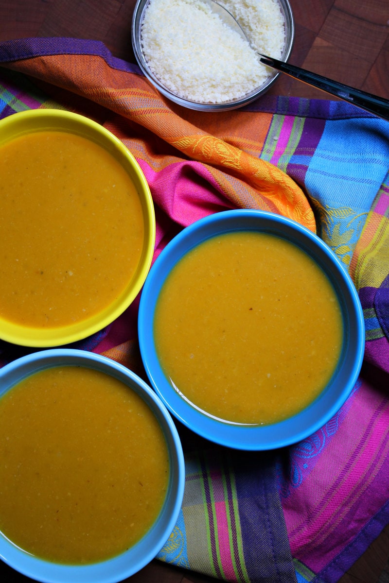 Tuscan Pumpkin White Bean Soup recipe from RecipeGirl.com #tuscan #pumpkin #bean #soup #fall #recipe #RecipeGirl Tuscan Pumpkin White Bean Soup served with grated Parmesan cheese