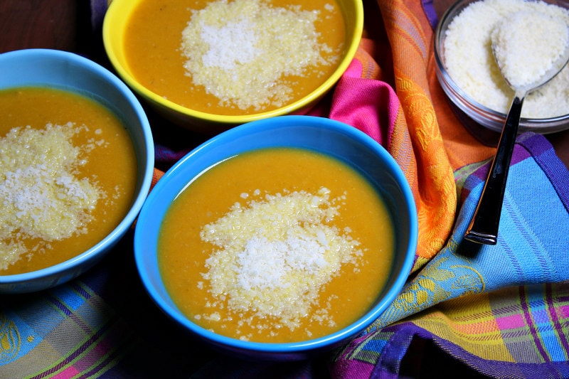 Tuscan Pumpkin White Bean Soup recipe from RecipeGirl.com #tuscan #pumpkin #bean #soup #fall #recipe #RecipeGirl Tuscan Pumpkin White Bean Soup served with grated Parmesan cheese