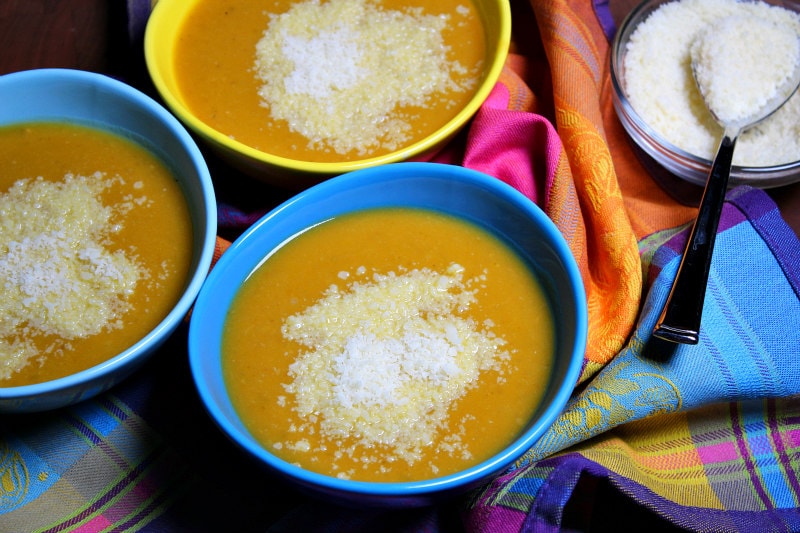 Tuscan Pumpkin White Bean Soup served with grated Parmesan cheese