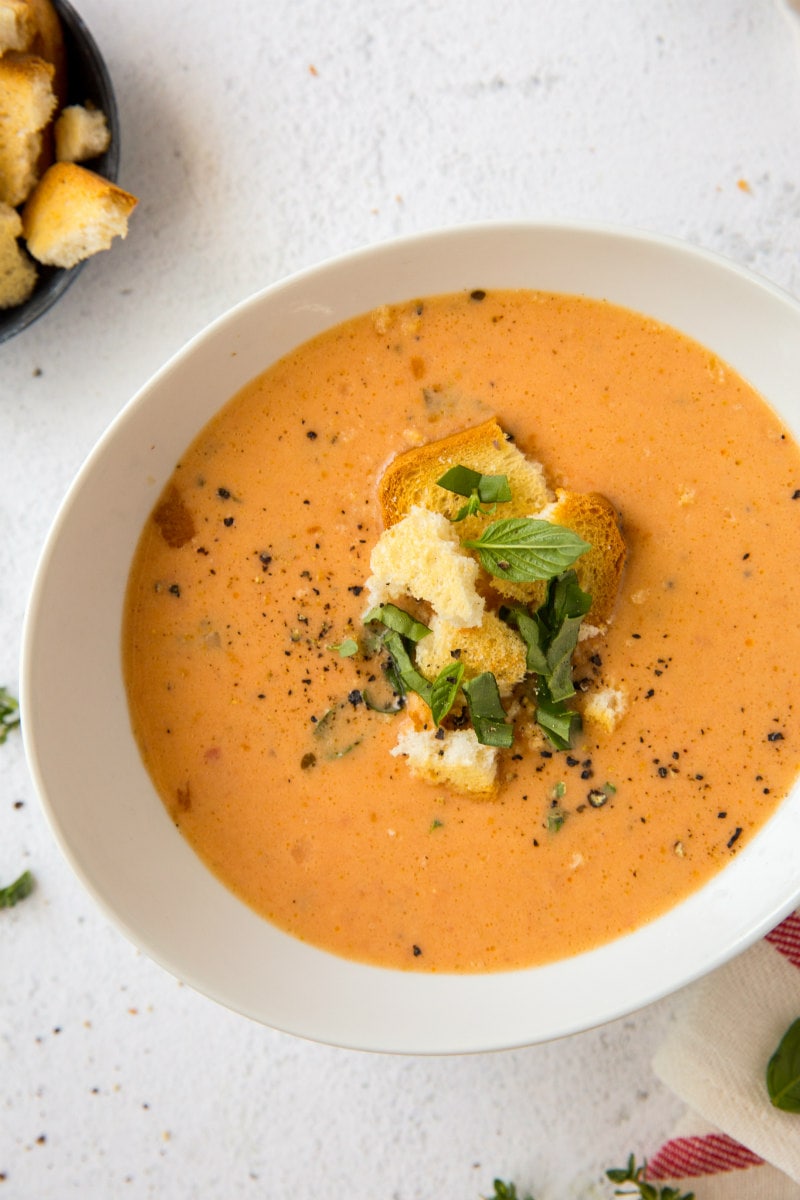 Herbed Tomato Soup in a bowl garnished with croutons