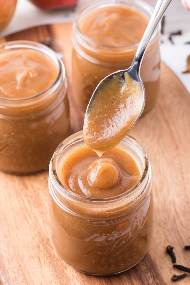 spooning apple butter from jar