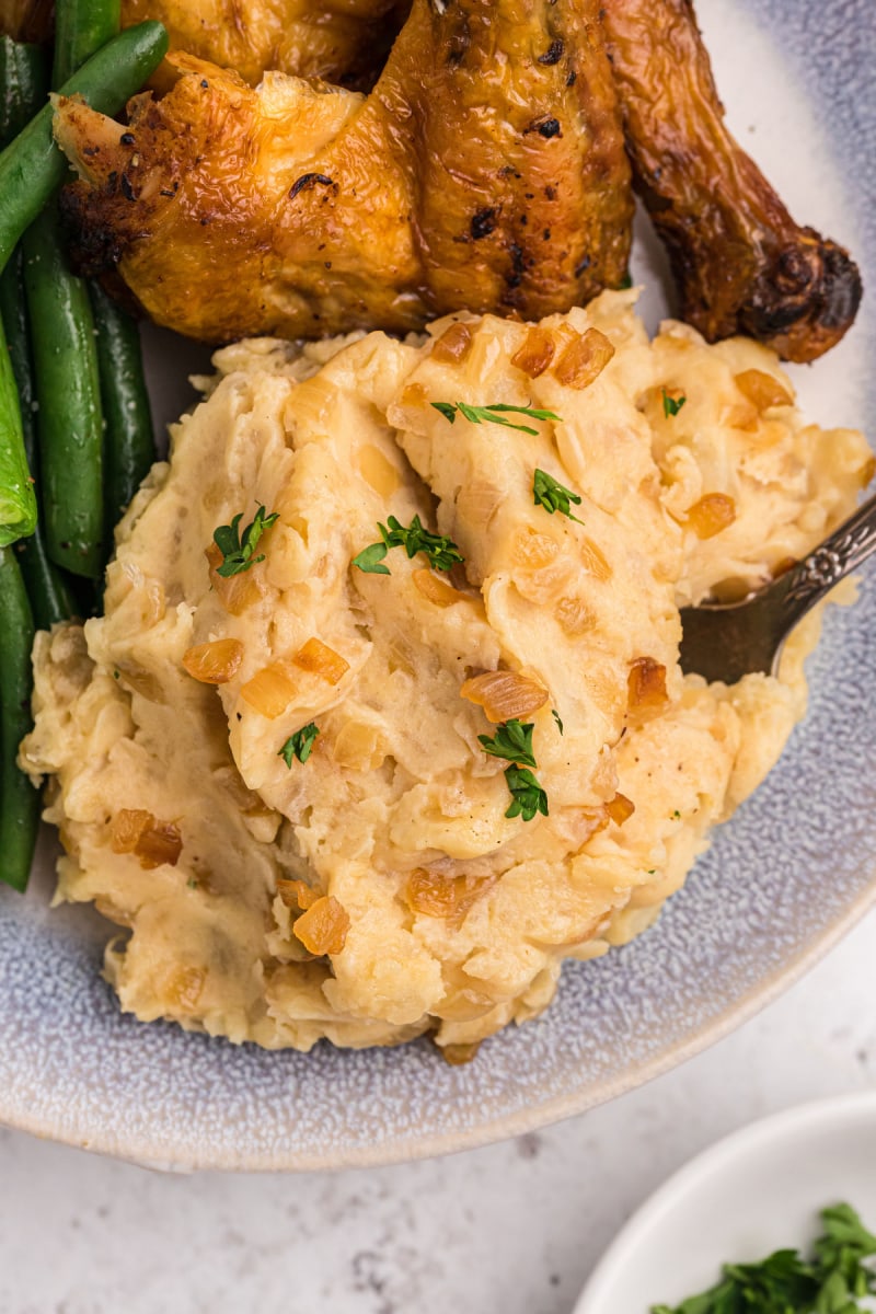 scoop of caramelized onion and horseradish mashed potatoes on a plate