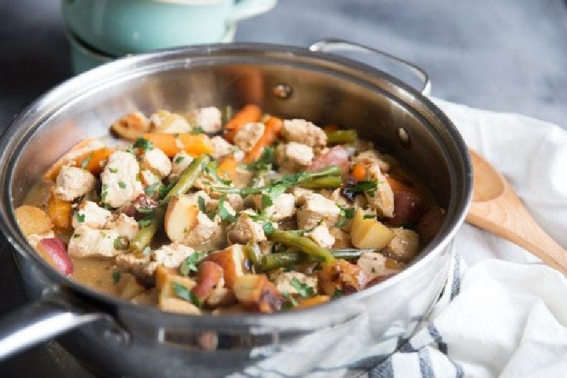 pan of chicken stew with balsamic roasted vegetables