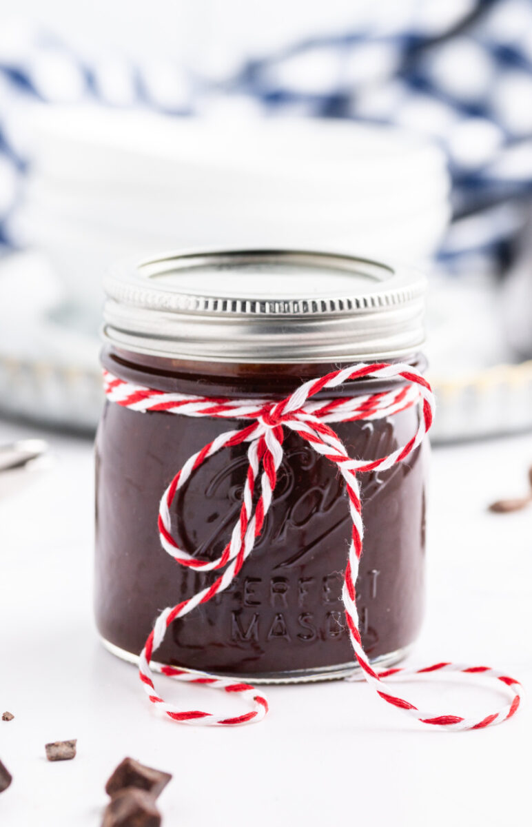 jar of chocolate fudge sauce with decorative string