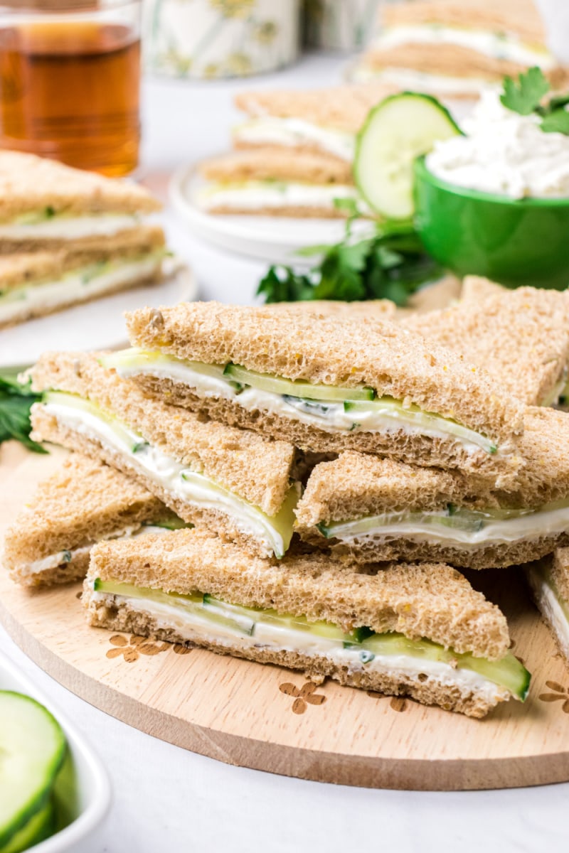 several goat cheese finger sandwiches stacked
