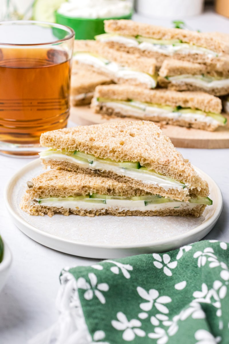 two goat cheese finger sandwich halves stacked on plate