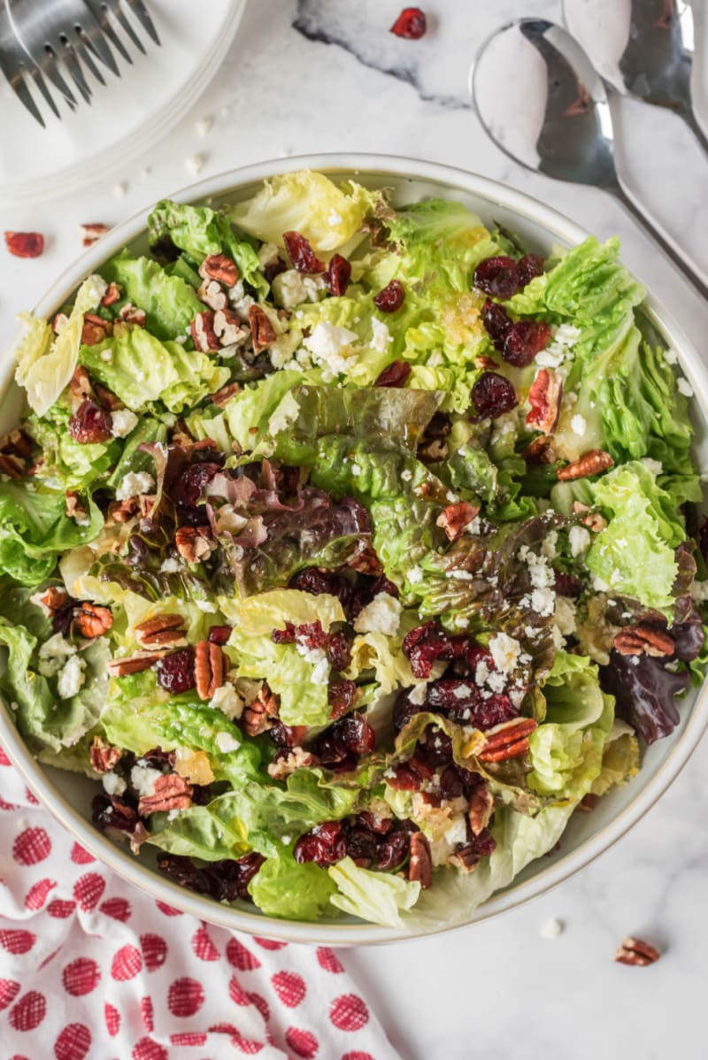 mixed green salad with apple cider vinaigrette in bowl