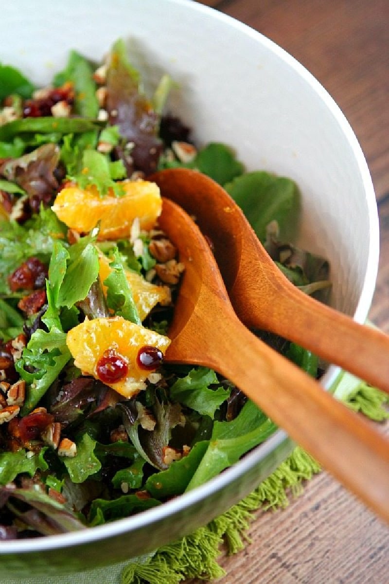 mixed green salad with oranges dried cranberries and pecans