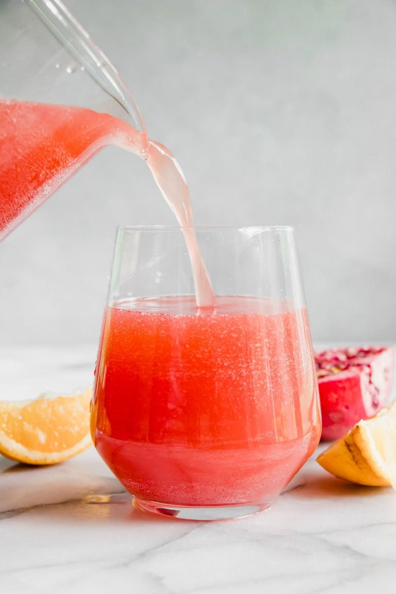 Pouring Pomegranate Punch into a glass