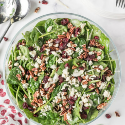 Spinach and Endive Salad with Blue Cheese and Pecans in a bowl