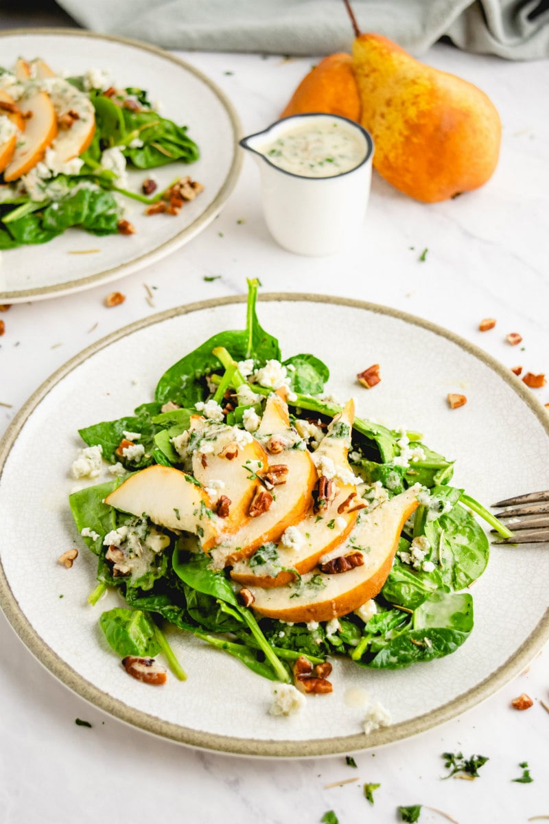 spinach and pear salad on plate