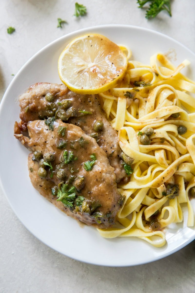 Veal Piccata recipe from RecipeGirl.com #veal #piccata #classic #italian #dinner #recipe #RecipeGirl Veal Piccata served with pasta