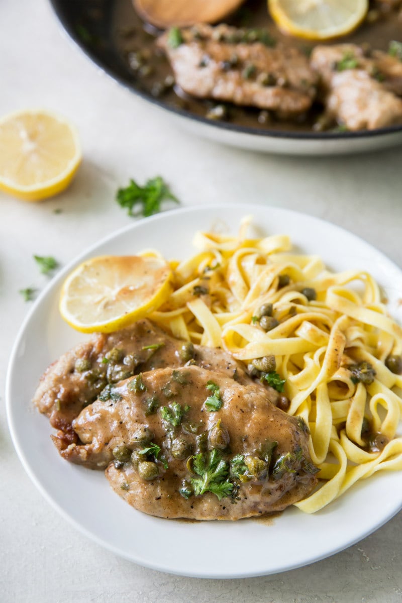 Veal Piccata recipe from RecipeGirl.com #veal #piccata #classic #italian #dinner #recipe #RecipeGirl Veal Piccata served with pasta