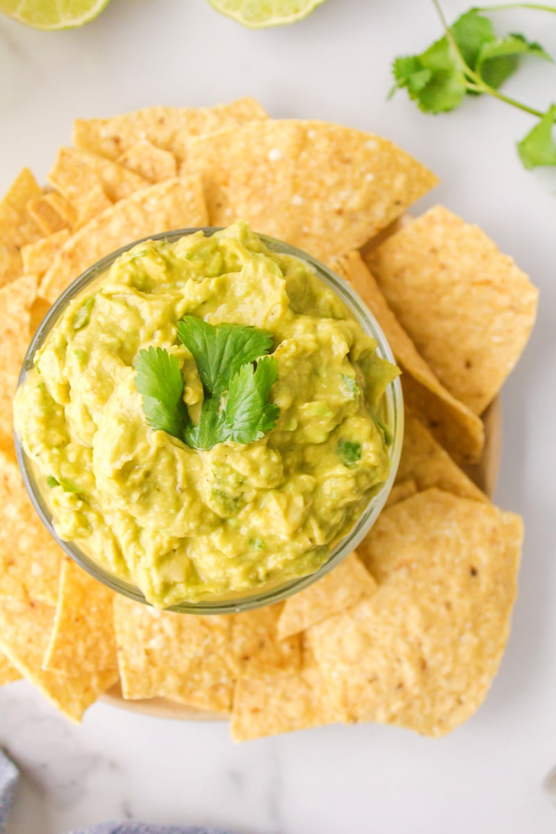 guacamole in a bowl with chips